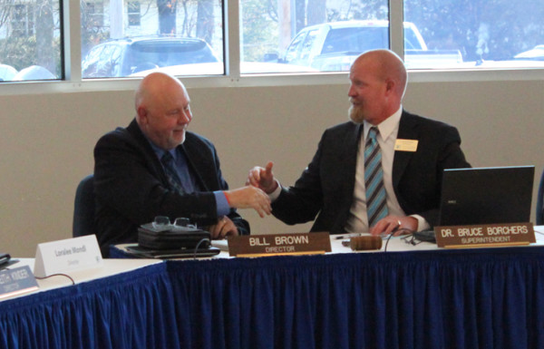 New BOE President Bill Brown Shakes hands with SUperintendent Dr. Bruce Borchers, whos expected to leave the district to move to Oak Ridge 