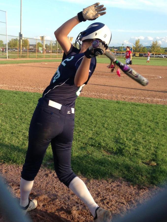 Megan Clince, junior, practices her swing at her game on Wednesday Sept. 3rd. Clince batted .423 last season. 