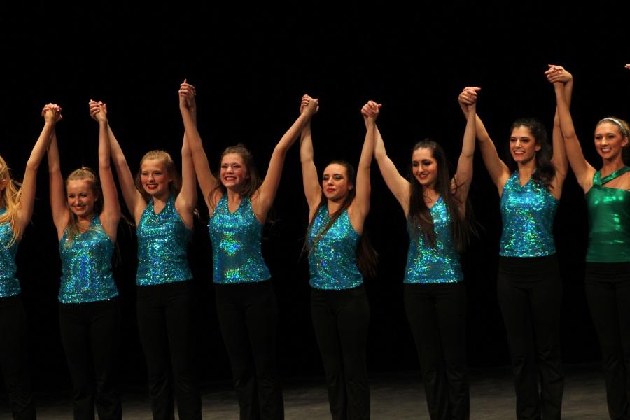 Mystique members take a bow during the finale of the showcase.