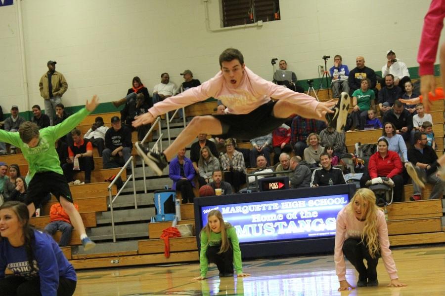 Andy Heller, junior, perfects a toe-touch. 