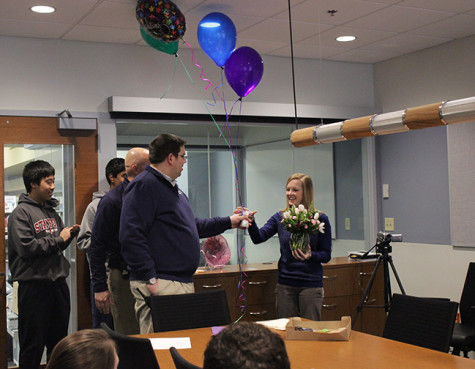 Brittany Fore, language arts teacher, receives flowers and balloons from the administration as they  announce her selection as MHSs teacher of the year on Monday, Feb. 24.