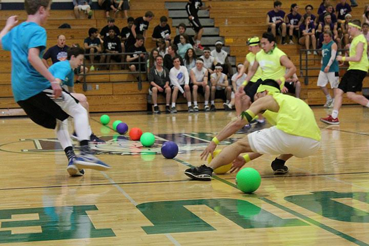 The Jolly Green Giants rush towards the balls at the beginning of the dodgeball game. 