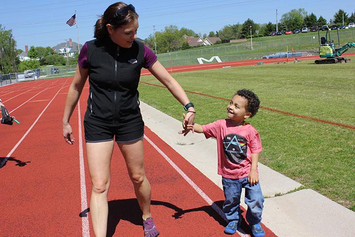 All the teachers were invited to bring their kids to school for Bring your kid to school day Friday May 1. Holman and her son, Hendrix, hold hands and walk the track during 4th hour. 