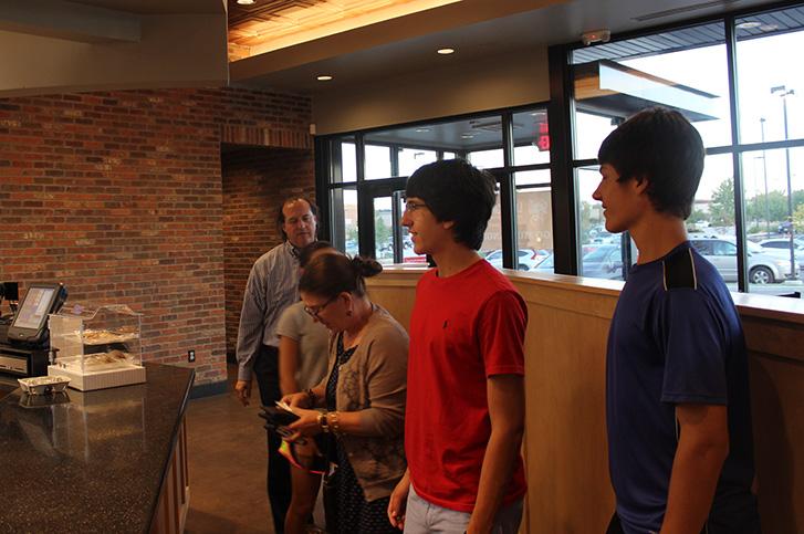 Sam Thompson, junior, and his family wait to pick up their orders at Lions Choice. The Lions Choice fundraiser for the MHS Renaissance lasted from 4: 30 p.m. to 8:00 p.m.