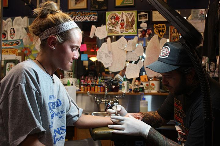 Megan Moore, senior, gets her first tattoo: a semicolon on her wrist. “The purpose of the semicolon as the symbol is that it is a punctuation mark, but it doesn’t end a sentence,” Moore said. “It continues a sentence and leads to another idea.”
