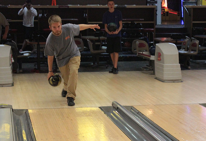Captain Austin Gray, senior, practices his swing at West County Lanes on Manchester Road. Gray said he has the highest average score on the team, with an average of 180-185. 