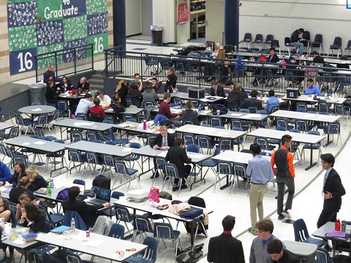 Competitors from 28 different schools wait in the commons until their debate rounds resume. All competitors are required to go through four debate rounds at minimum.