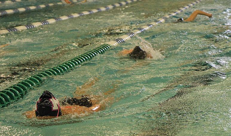 Taryn Zweifel, freshman, practices with the team for State. State occured on Feb. 20 and 21 where select girls represented the swim and dive team. 