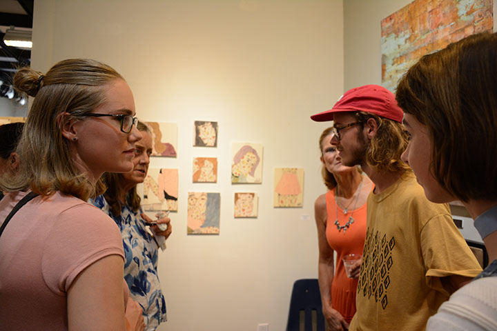 Nick Vaaler speaks with guests at his art gallery. The gallery took place on Friday, Aug. 12. 