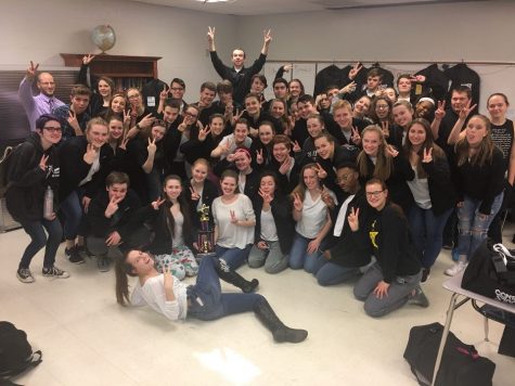 The Show Choir team holds two fingers up after placing second at a competition in Pleasant Hill, MO. The photo was taken by a host at the competition, on Saturday, Jan. 21. “This was my first year doing this, so it was a new experience, doing the whole competition thing,” said Austin Cochran, junior. “It was really fun being closer.” 