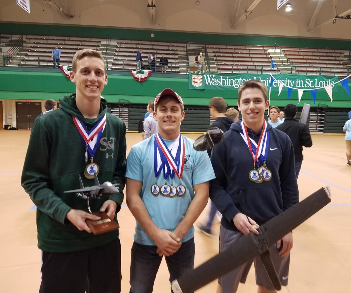 Left to right: Alex Myers, JT Schuman, and Daniel Swegle, seniors, pose after winning the annual Boeing Engineering Challenge. They placed first out of the teams in their division.