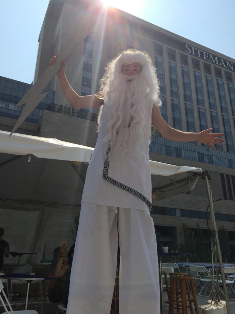 Will, an actor with Circus Kaput, dresses as Zeus, the ancient Greek god of the sky, for the festival weekend.