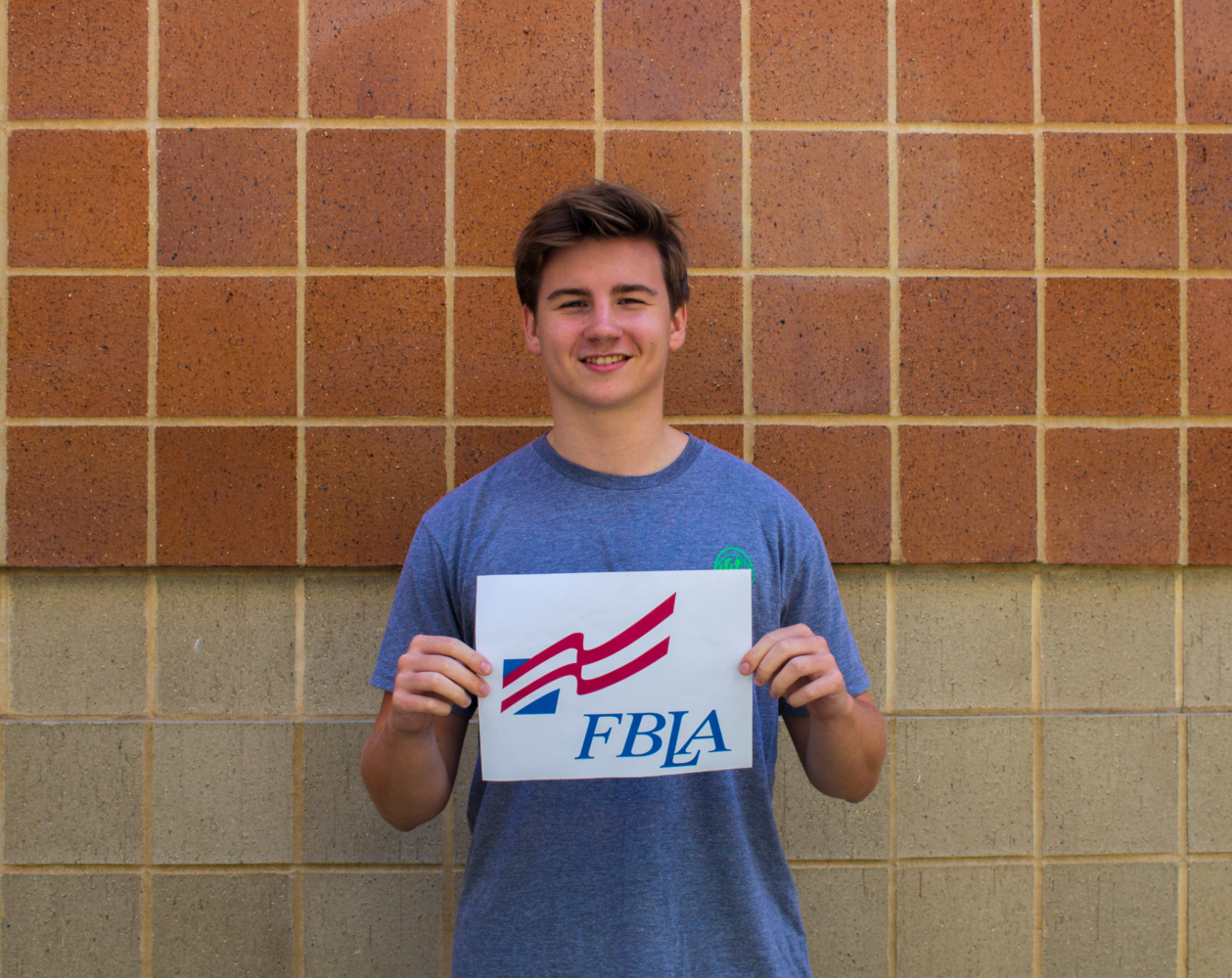Logan Paul, senior, poses for a picture with the FBLA logo. Paul is the President of MHS FBLA chapter.