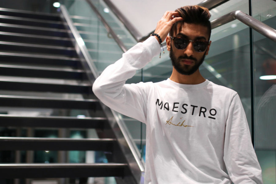 Arman Virdee, senior, poses with his companys Collection II shirt. Virdee launched Maestro in October of 2016.