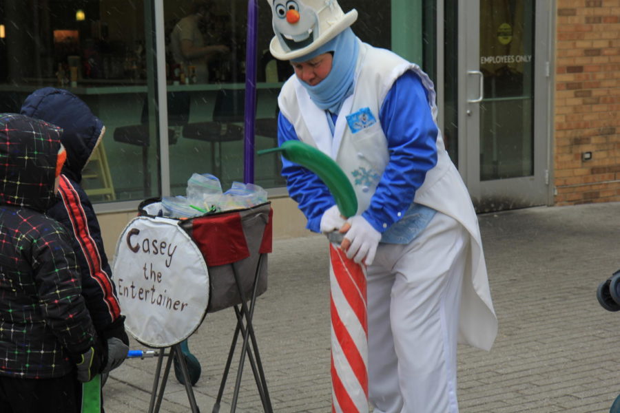 Casey the Entertainer makes balloon animals for those waiting in line. 