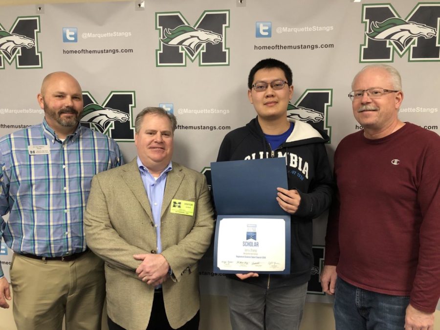 Jerry Zhang, senior, receives the 2018 Regeneron Science Talent Search Scholar Award on March 6. He conducted research to create a computer simulation aimed at removing errors within the physical experiment. 