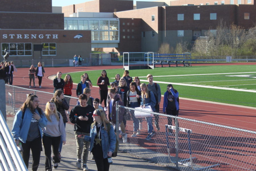 Students+walk+out+of+school+at+8%3A10+a.m.+on+Friday%2C+April+20%2C+which+marks+the+19th+anniversary+of+the+Columbine+shooting.+Students+all+around+the+nation+participated+in+the+Walkout+to+call+for+action+against+gun+violence.