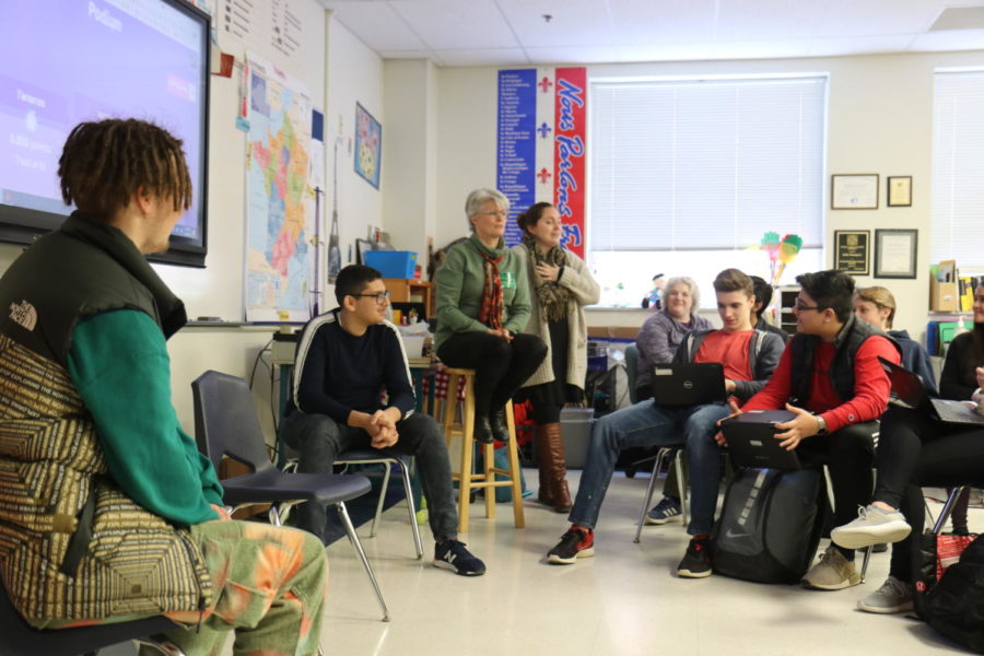 [Left to right]  Quentin Nauge and Salim Saoud, juniors, speak to students in a french class after giving a presentation on on cultural differences between the U.S. and France.