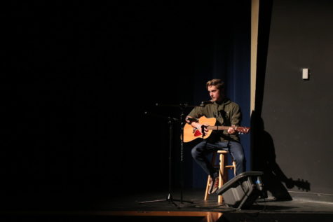 Andrew Messina, junior, performs “Mad World” by Gary Jules at the talent show September 19. Messina said he started playing guitar earlier this summer. “I had it for the longest time and I did lessons in eighth grade but I really wanted to get back into it,” Messina said.