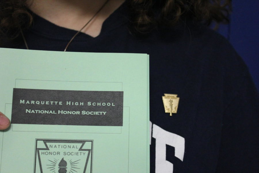 NHS induction ceremony program and pin.