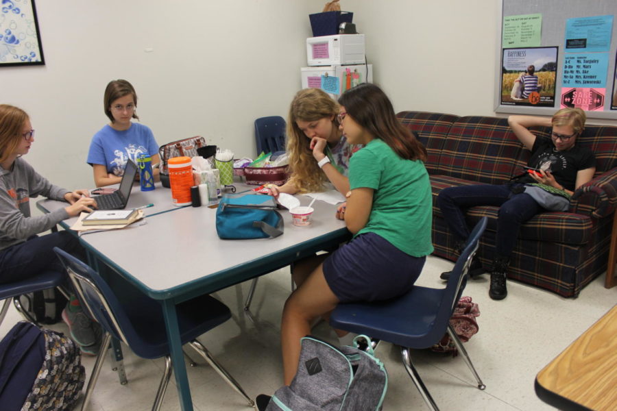 Mia Kreissler, junior; Lauren King, sophomore; and Ginger Ramirez, sophomore, eat lunch and read in the Gifted Room.  