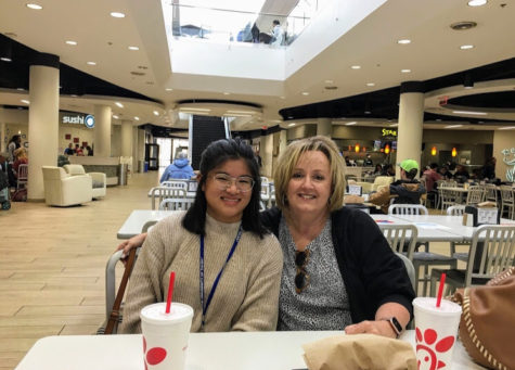 Madison Fischer, senior, enjoys a meal from Chick-fil-a at the mall with her mother. “Being adopted has given me more perspective on being a foreigner and a minority in America and how lucky I am compared to many immigrants that never get a chance to come to America legally,” Fischer said. Photo used with the permission of Madison Fischer.
