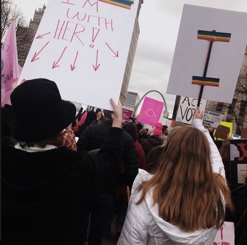 Mal Tockman, junior (left) and Liv Kalemis, junior (right) hold their posters at the Womans March last January in downtown St. Louis to support the LGBTQ+ community. The more people who openly share their pronouns, cis or trans, the less of a stigma there will be around those who have discovered their identity, Kalemis said.