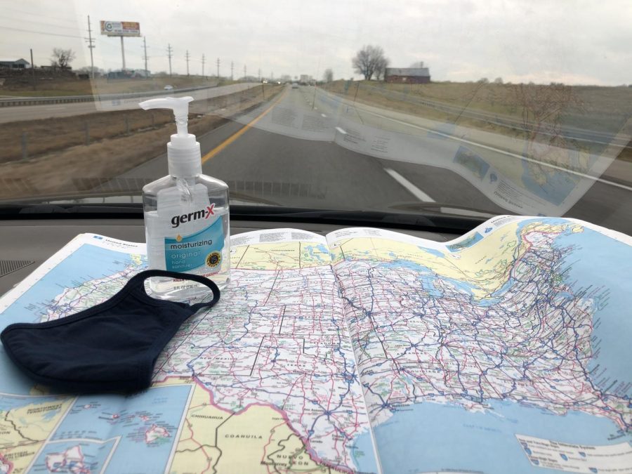 Hand sanitizer and face coverings are important items to keep handy when travelling during COVID-19. Both items help in preventing the spread of the virus.