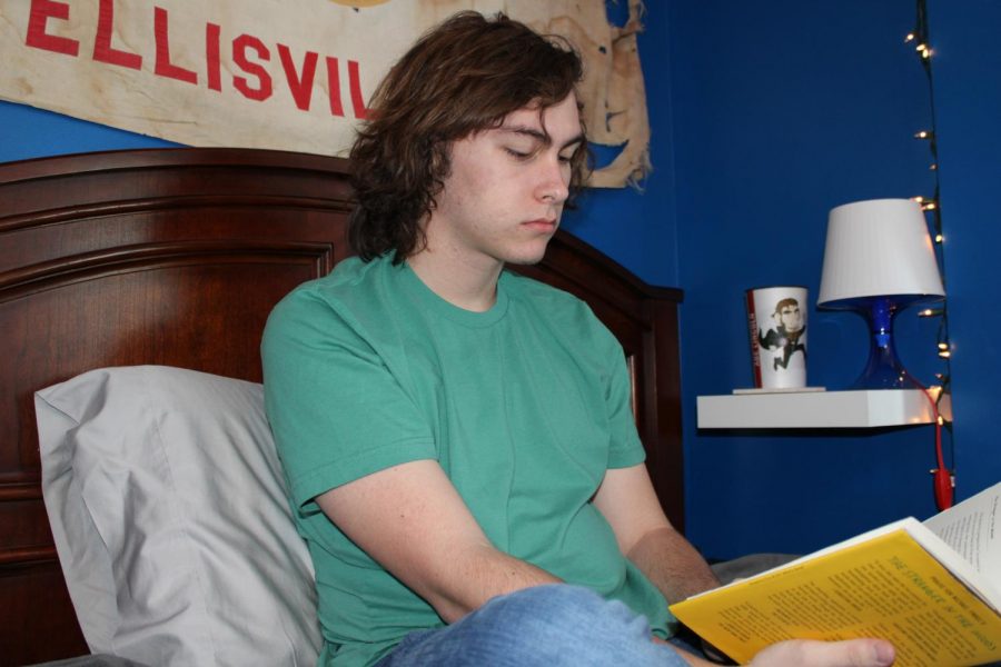 Travis Young, senior, spent time during his 14-day quarantine reading and playing video and card games with his family. As a participant in this study, Young is joining a list of other family members who have opted to participate in studies related to COVID-19, such as vaccine trial research.
