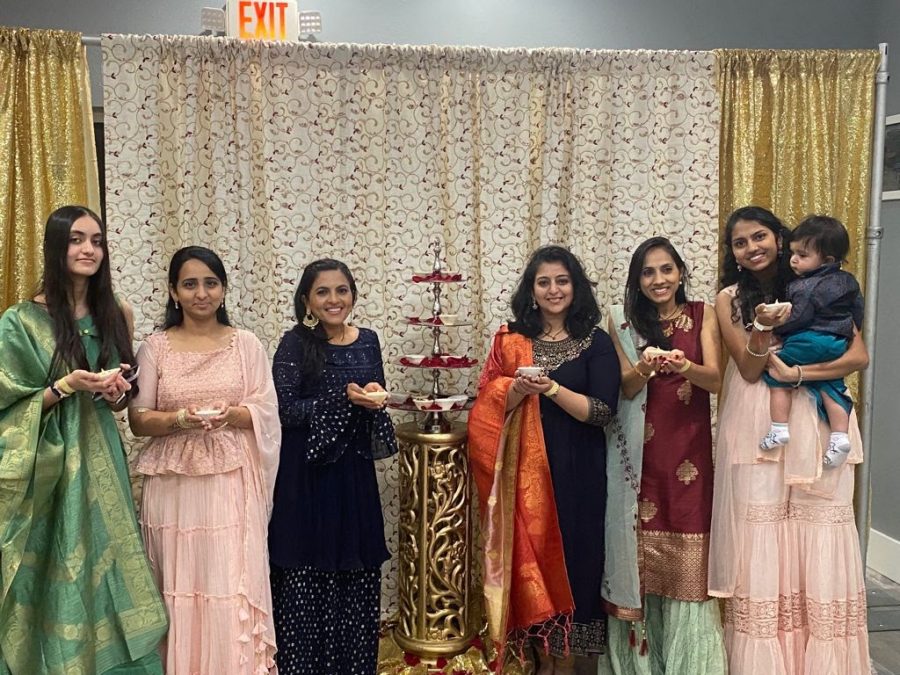 Aasvi Patel, junior, (on the far right) with family and friends at a Diwali party on Nov. 6. They are dressed in their cultural clothes and holding candles to celebrate the festival of light.