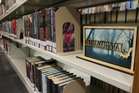 Joseph Calvin, senior, created a genre sign for the paranormal book section. I enjoy reading these types of books, Calvin said. So, I like that I was able to create a sign for it.