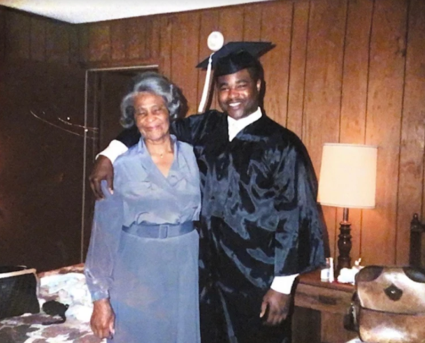 Hudson poses with his mother after graduation. He came from a single parent family and was the youngest of nine kids. Even though his mother didnt have a high school education, Hudson was able to graduate from Missouri State University and get his masters degree. 