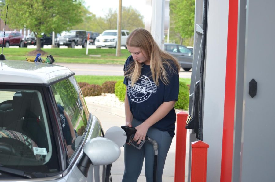 Aubrey Adams, junior, puts gas in her 2010 Mini Cooper at Petro-Mart for about $50, a jump from her usual $37. This is due to the increase in gas prices in response to the impending invasion of Ukraine by Russia. The increase is mainly caused by increased sanctions by both the U.S and other countries who have taken Russian oil off the market.