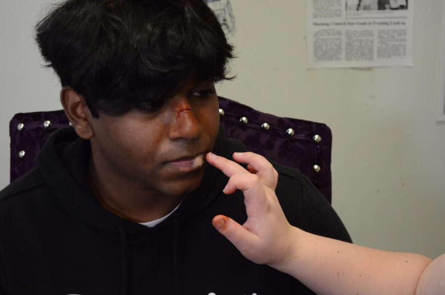 Here, Ginny Pisoni does a beaten-up look on Shyam Punnachalil. She used her favorite Scar wax and fake blood to complete the look and make it as realistic as possible. Its like this paste stuff that looks like skin. You can blend it in and its really fun to play with, Pisnoi said. 