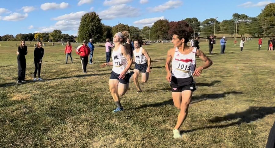 Niko+Kilo%2C+senior%2C+and+his+teammate%2C+Willem+Hummel%2C+are+running+a+5K+as+they+pass+a+boy+during+the+Hazelwood+cross+country+meet+on+Oct.+7.+As+they+passed+the+boy%2C+they+secured+the+Varsity+cross+country+teams+1st+place+in+the+meet.+Kilo+placed+6th+in+the+race%2C+and+Hummel+placed+5th.+We+gave+it+our+all%2C+Kilo+said.