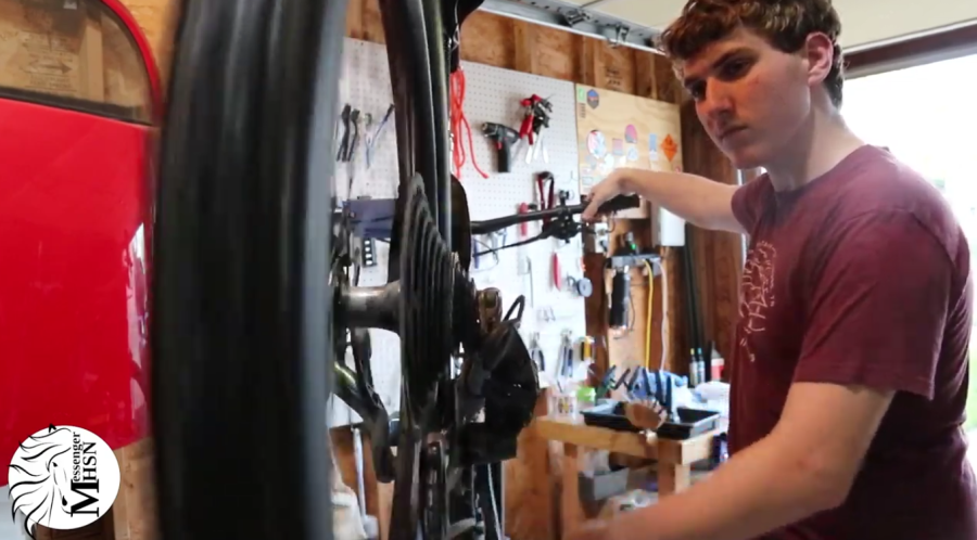 Rusty Willis, senior, repairs a bike for his shop. Rusty opened his shop during lockdown, when bike shops were booked.