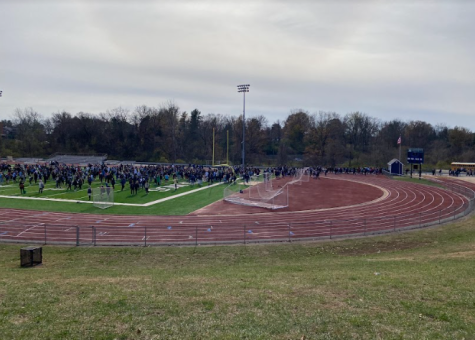 Students who arrived to school in the form of bus transportation evacuated to the school’s football stadium awaiting their transportation home.
