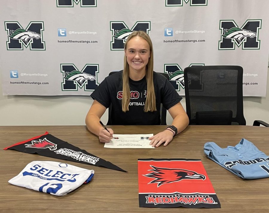 Madison+Carney%2C+senior%2C+signs+her+official+commitment+letter+at+her+signing+day.+Carney+will+play+softball+at+Southeast+Missouri+State+University.+