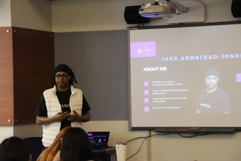 Jaer Armstead-Jones speaks to students attending his author visit on Feb. 21. During his visit, Armstead-Jones spoke about his experiences as a writer and a self-published author. 