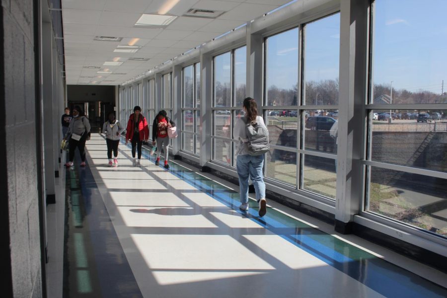 Students walk across the glass bridge during fourth lunch. This year, there were 2176 students enrolled at MHS, but next year that number drops to 2130. This is part of a five year trend that Principal Dr. Steve Hankins said is part of MHS getting back to normal after an enrollment spike.