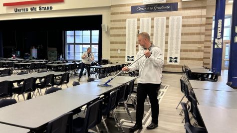 Principal Dr. Hankins aids the lunch and administration staffs in cleaning the Commons after every lunch shift. Next year, he will assume the role of assistant superintendent of student services for the district.