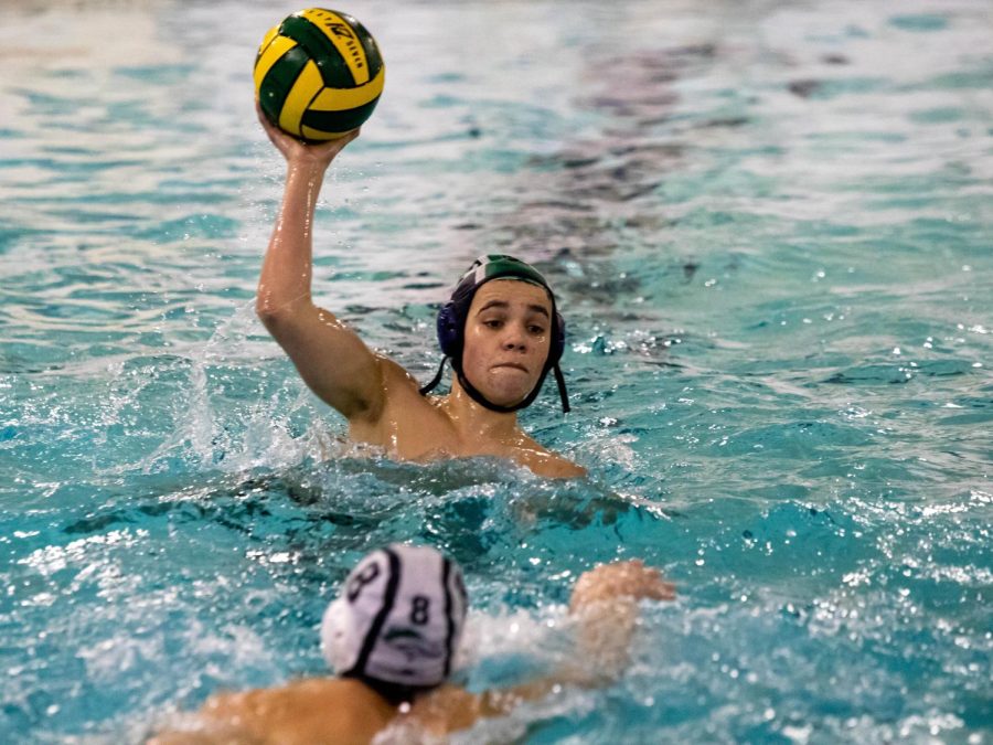 Nico Case, senior, attempts to score during water polo practice on Friday, March 10.