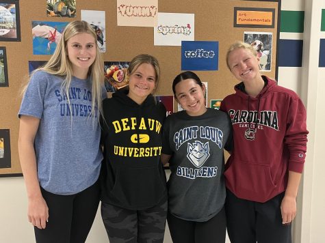 Today, May 1, marks National Decision Day, when high school seniors are supposed to be making their last choices regarding college. From left to right, seniors Madi Bode, Lauren McGauley, Kahley Sheen and Cece Kreh represent their future colleges on National Decision Day. 