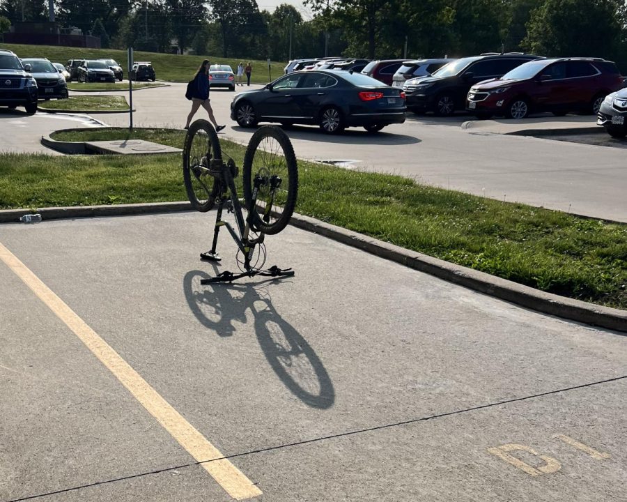 Sam Stremlau, senior, parked his bike in his usual parking spot at the start of the school day.