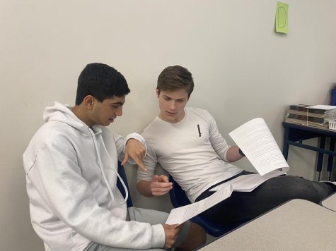 Carl Taraporevala, sophomore, and Drew Mathers, sophomore, pratice lines together in preparation of their audition for the Glass Menagerie play on May 15. Taraporevala and Mathers have been participating in theater since last year, both on cast for Legally Blond, and participating in other MTC productions in either crew or cast. 