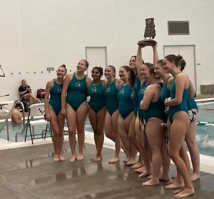 The+girls+water+polo+team+stands+victorious+after+winning+second+at+State+for+the+second+year+in+a+row.