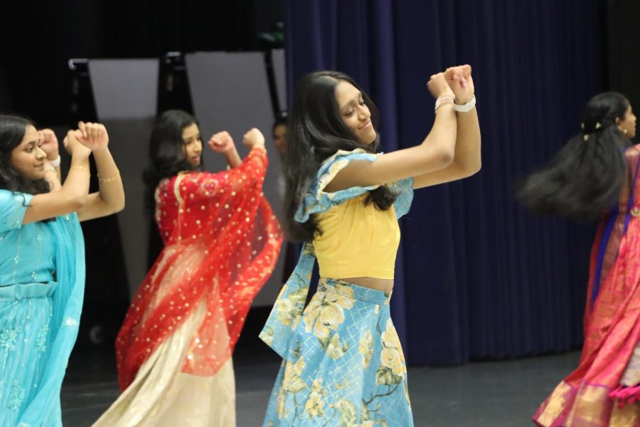 Samvida Batchu, sophomore, performs Bollywood dancing with
her friends in the Commons for the Festival of Nations.