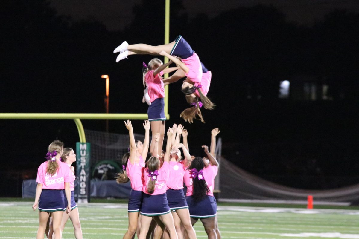 Cheerleaders perform during halftime at the Friday, Sept. 8, home game. At that point, the Mustangs were already in the lead.