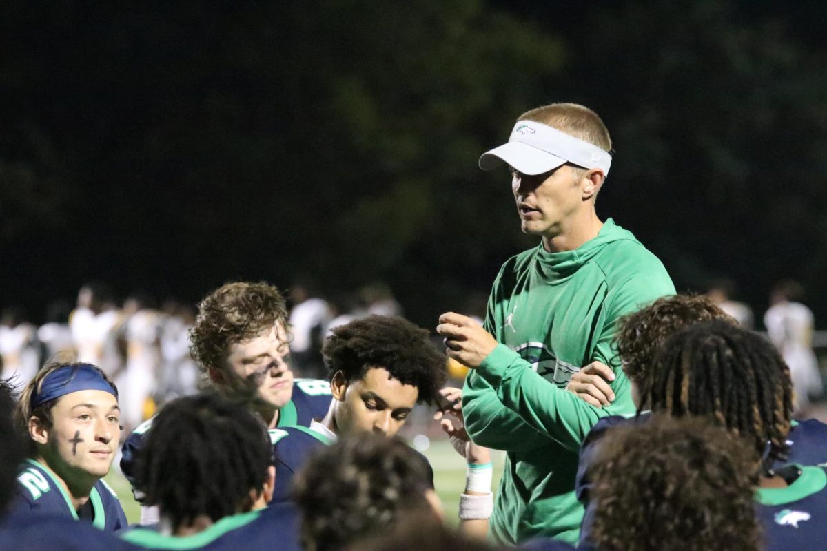 Michael Stewart, coach, gives the players a speech after their 24-7 win against Hazelwood Central on Friday, Sept. 8, at home. 