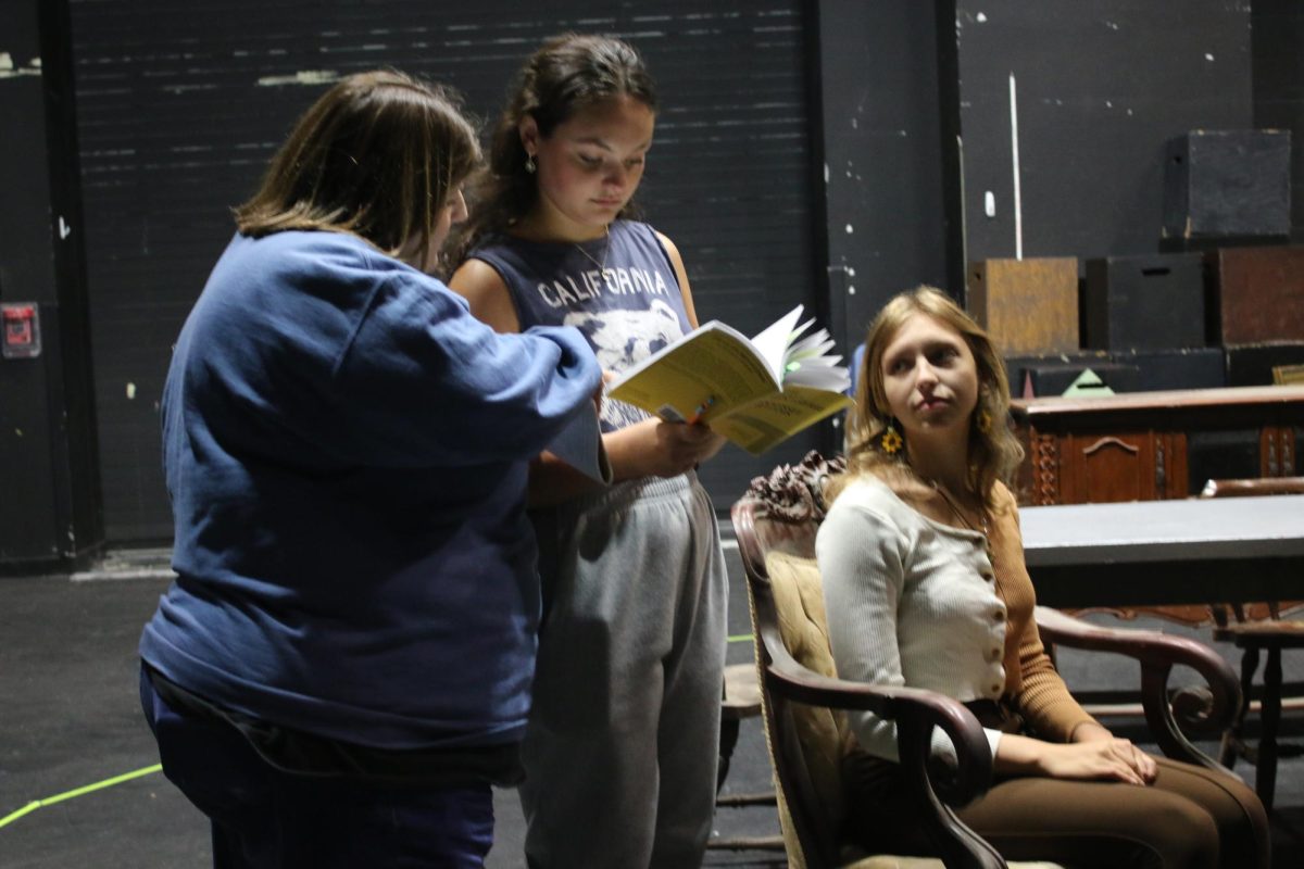 Rebecca Blindauer, theater teacher, coaches Allie Lappin, junior, in learning her role of Amanda Wingfield in the fall play The Glass Menagerie. Kara Miller, senior, will play Laura Wingfield. The cast of the play hope to perform it at the International Thespian Society Conference this year.